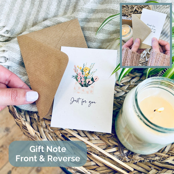 scented soy wax candle in clear glass jar.