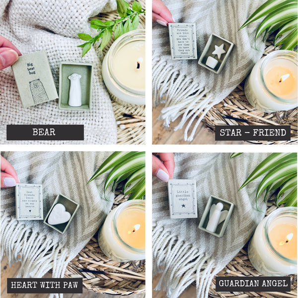 scented soy wax candle in clear glass jar.