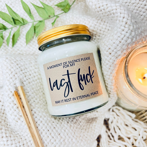 Scented Soy Wax Candle - A Moment of Silence for My Last Fuck. A scented soy wax jar candle on a soft background.
