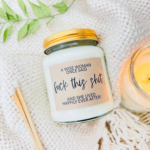 Scented Soy Wax Candle - A wise woman once said 'Fuck this shit' and she lived happily ever after! A soy wax candle on a soft fluffy background.