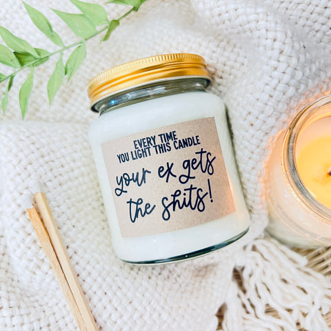 Scented Soy Wax Candle - Every time you light this candle, your ex gets the shits. A soy wax scented candle on a fluffy white background.